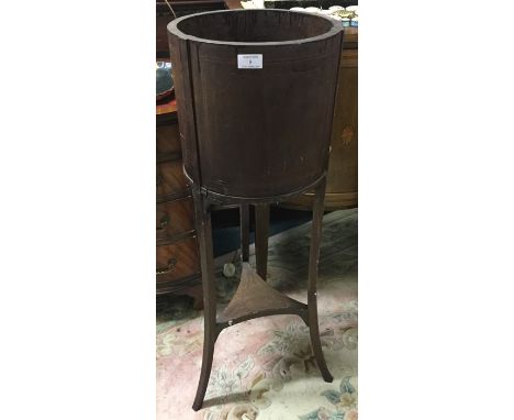 A mahogany inlaid planter.