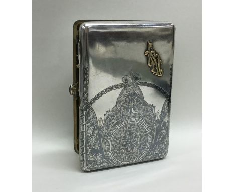 A good quality Russian silver and Niello cigarette box with amethyst clasp and gold initials. Approx. 168 grams. Est. £200 - 