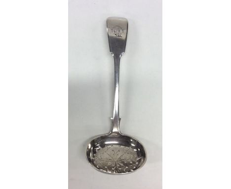 A silver fiddle pattern sifter spoon with pierced bowl. Exeter. By JW. Approx. 46 grams. Est. £30 - £40.