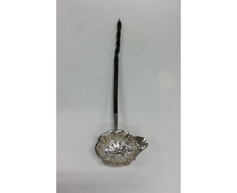 A Georgian silver toddy ladle with whalebone handle. Approx. 46 grams. Est. £20 - £30.