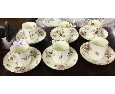 A decorative Royal Worcester coffee cups and saucers.
