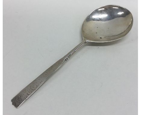 An early 17th Century Norwegian silver spoon decorated with flowers and scrolls and engraved '1642'. Approx. 30 grams. Est. £