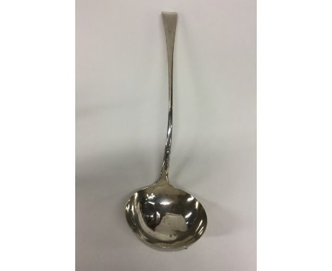 A Georgian OE pattern silver bottom marked ladle. London. By GB. Est. £120 - £150.