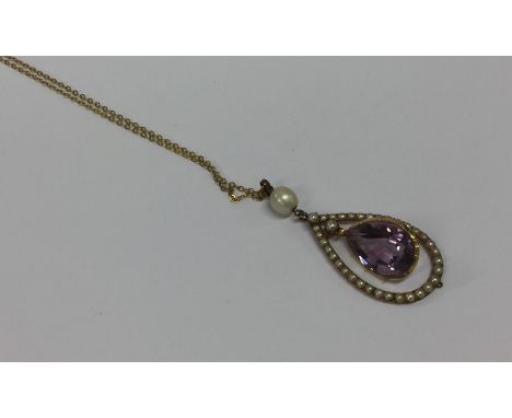 An attractive amethyst and pearl drop pendant on gold fine link chain. Approx. 9.2 grams. Est. £250 - £350.