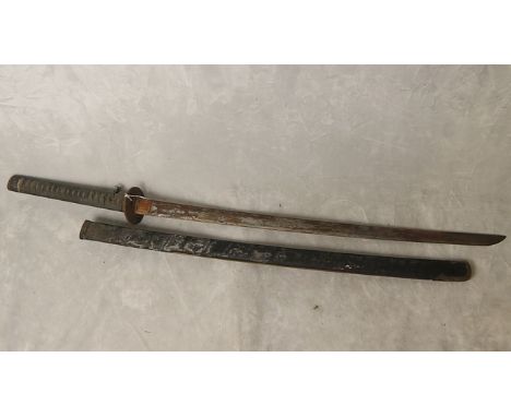 An early 20th century Japanese sword having a shagreen handle, brass guard and green scabbard, A/F