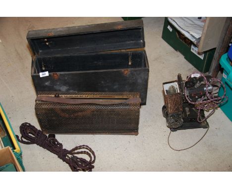A Pathescope Cine projector and a cased Kodascope model K-50 voltage regulator.