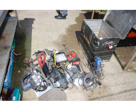 An Aluminium trunk containing electrical items including Rip Saw, Router, electric planes, receptacle saws and 5" angle grind