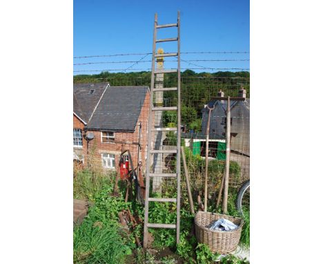 Eleven rung wooden ladder (some metal stays are missing).