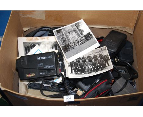 A box of camera cases, old Videomatic VHS camcorder, photographs, etc.