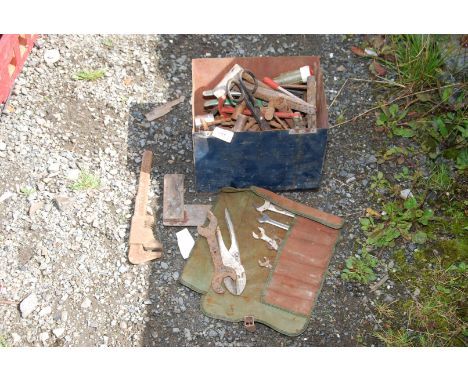 A metal box of various tools.