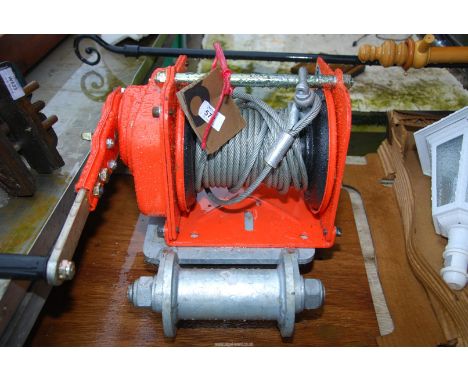A Heavy duty winch and cable, plus a roller.