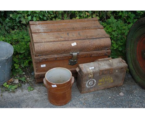 A metal trunk, an ammunition case and a crock pot (no lid).