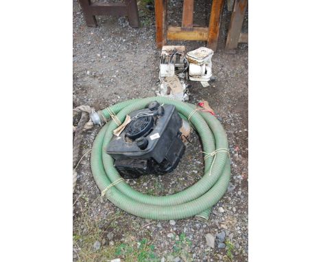 Briggs and Stratton Engine (turns), a petrol engine off lawnmower, green suction hose, and water filters etc.