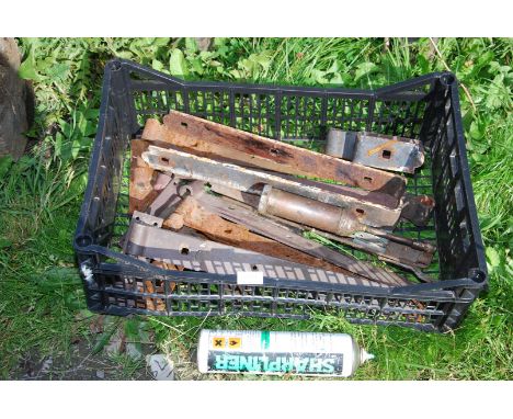 Crate of door and gate hinges, grease gun and marker paint.