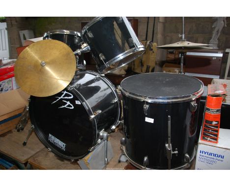 A Drum kit - including four drums, one seat, two cymbal percussion instruments, and a foot pedal.