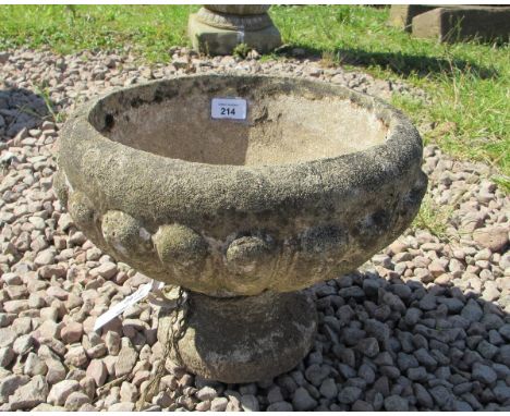 Small stone planter on plinth 