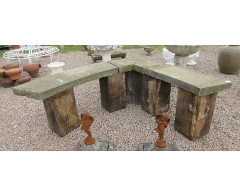 Stone corner bench on wooden pedestal legs 