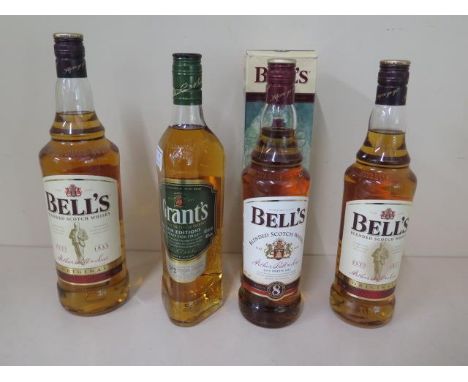 A litre bottle of Bells blended Scotch whiskey, a 70cl bottle of Bells whisky, a 70cl bottle of Bells aged 8 years whisky and