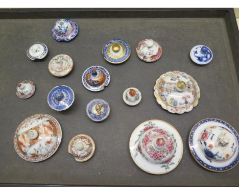 A collection of fourteen Chinese 18th and 19th century porcelain tea pot lids and caddy lids, four in good condition, four wi