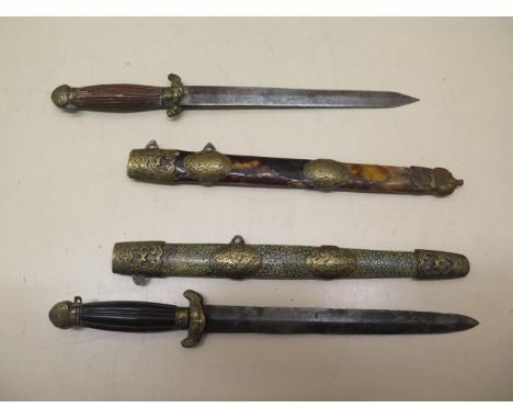 Two very similar Oriental daggers, one with a shagreen scabbard, the other with a tortoiseshell scabbard, blade length 16cm, 