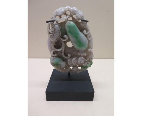 A jade carving on stand, carving 10cm x 7cm, in good condition 