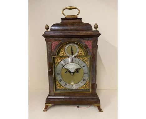 A good quality 18th century and laterwalnut and brass mounted striking bracket clock . The brass and silvered dial having cal