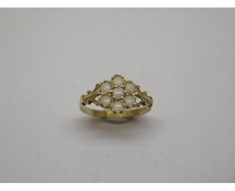 A hallmarked 9ct yellow gold opal cluster ring, size W, approx 1.8 grams, in good condition 