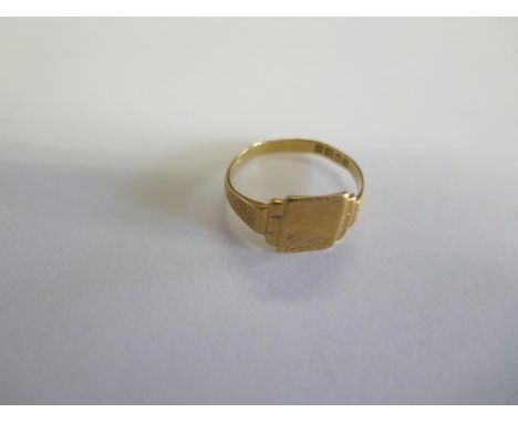 A hallmarked 18ct yellow gold signet ring, size V, approx 3.7 grams, in worn condition 