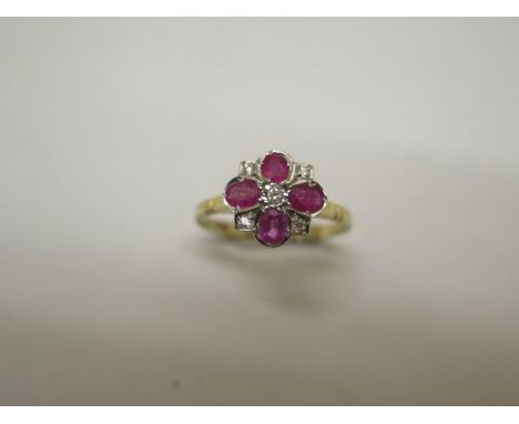 An 18ct hallmarked yellow gold ruby and diamond ring, size O, approx 2.5 grams, head approx 10mm wide, in good condition 