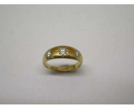 A hallmarked 18ct yellow gold three stone diamond ring, size L, approx 5 grams, in generally good condition and diamonds brig