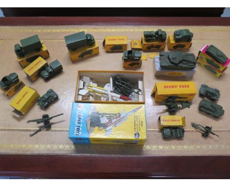 A collection of 15 Dinky military vehicles, 11 with boxes (tank is part box), a boxed Corgi Toys bloodhound missile (nose ben