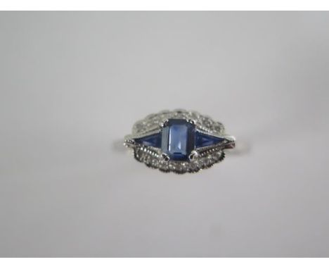 An Art Deco style sapphire and diamond ring set in 9ct white gold, hallmarked, ring size N, in good condition 