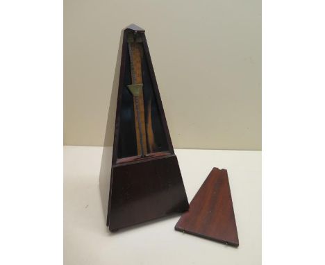 A French mahogany cased  metronome with  plaque, dated 1815, 30cm tall, in working order, slight wear to case and expansion t