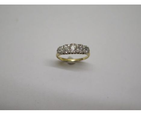 An 18ct yellow gold five stone illusion set diamond ring, size O/P, approx 3.5 grams, diamonds bright some wear mainly to hal