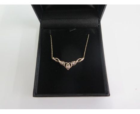 An Art Noveau style diamond and 9ct yellow gold pendant necklace, marked 375, 47cm long, approx 2.5 grams in good condition 