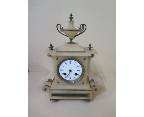 An alabaster striking mantle clock, 30cm tall, reasonably good condition, presented by the congregation of the Christian Unio