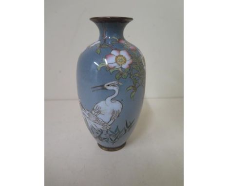 An early 20th century Japanese cloisonne vase decorated with wild roses and heron, 16.5cm tall, in good condition 