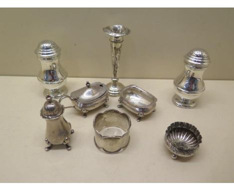 Six pieces of silver cruet, a serviette ring and a dented weighted vase, weighable silver approx 9.38 troy oz 