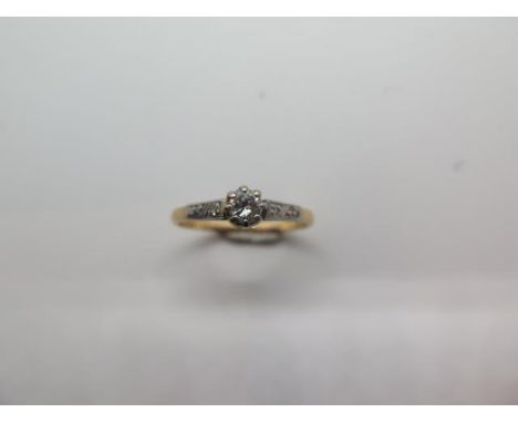 An 18ct gold and platinum diamond ring, size R, approx 2.4 grams, diamond approx 0.20ct, marked 18ct Plat, some wear but gene