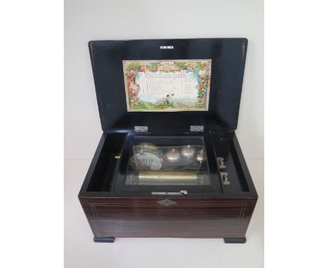 A 19th century Swiss rosewood and faux rosewood music box with drum and three bells playing eight airs, 15.5cm cylinder, 22cm