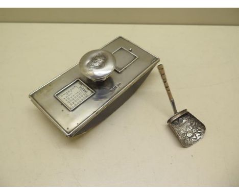 A silver desk blotter with calendar and stamp compartment, 14cm long, handle dented but otherwise reasonably good and a silve