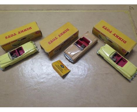 Three boxed Dinky toys American cars, two Cadillac Tourers, no 131, and a Packard convertible, no 132, cars generally good so