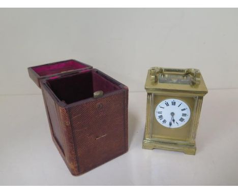A French brass carriage clock striking on a gong, 14cm tall with handle down, in running order last serviced in 2017 for £338