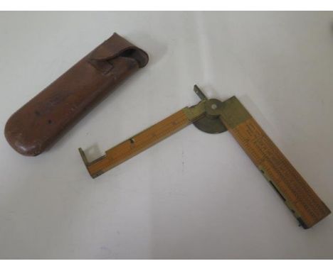 A good quality folding pocket 12" surveyors level with compass and levels in original leather case 