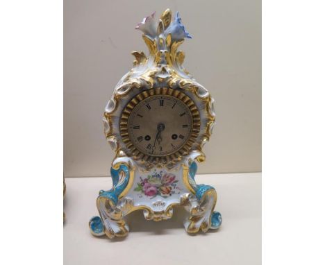 A French porcelain mantle clock with a Japy Freres movement silk suspension striking on a  bell - height 27cm - repair to one