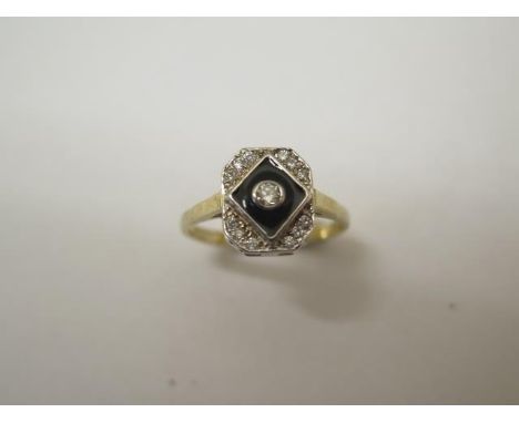 A diamond and enamel 9ct hallmarked yellow gold ring, size O, approx 2.6 grams, head approx 10mm x 8mm, in good condition 