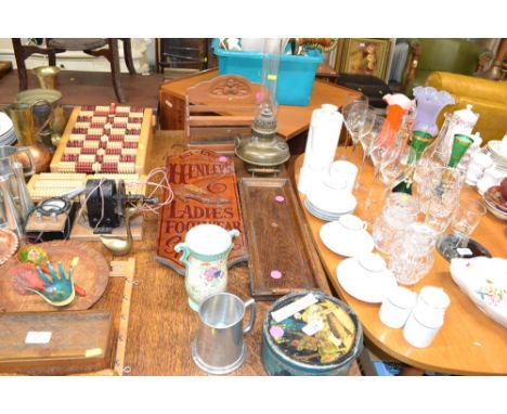 A reproduction ladies footwear sign, an oak twin handled tray, an oil lamp with glass chimney, Crown Devon vase, a tin of var