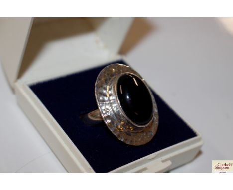 A large silver and black onyx dress ring, size T/U, total weight approximately 11g