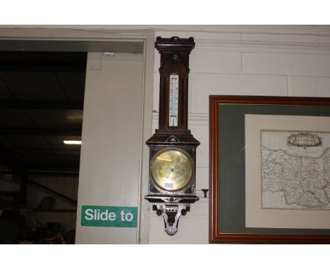 An oak cased CSSA Limited London aneroid barometer