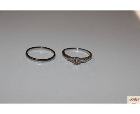 A .950 mark platinum and diamond set ring and a .950 marked platinum wedding band